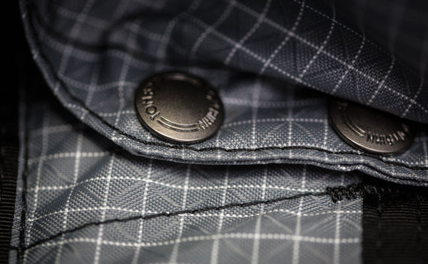 A close-up of the snaps for the removable frame sheet.